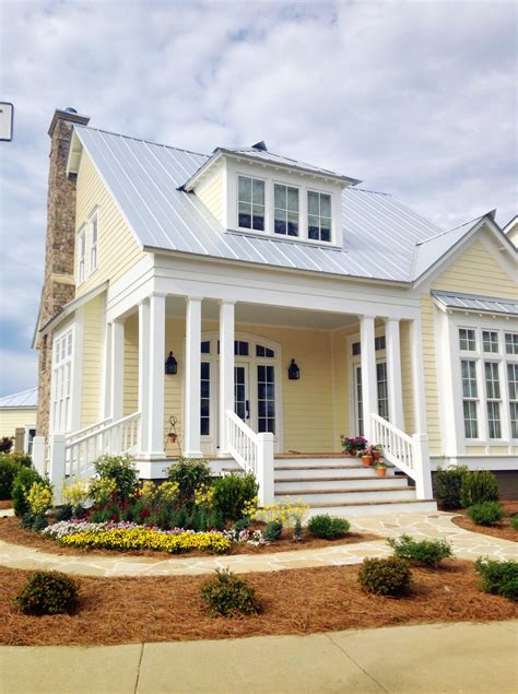 yellow house silver metal roof|pictures of houses painted yellow.